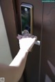 A person is opening a door with a smart lock.